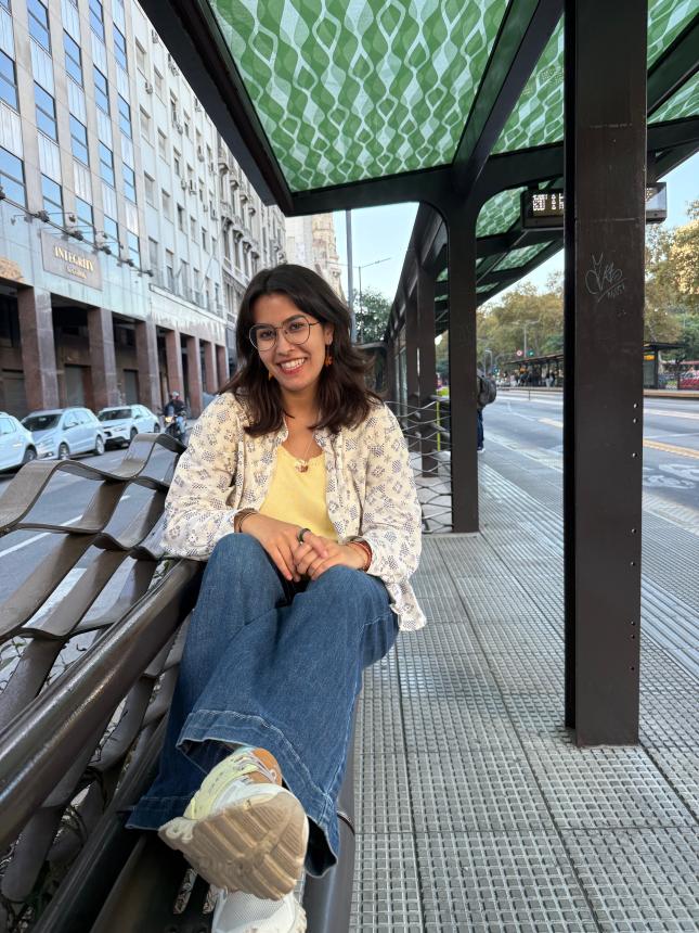Amelia at bus stop with green roof
