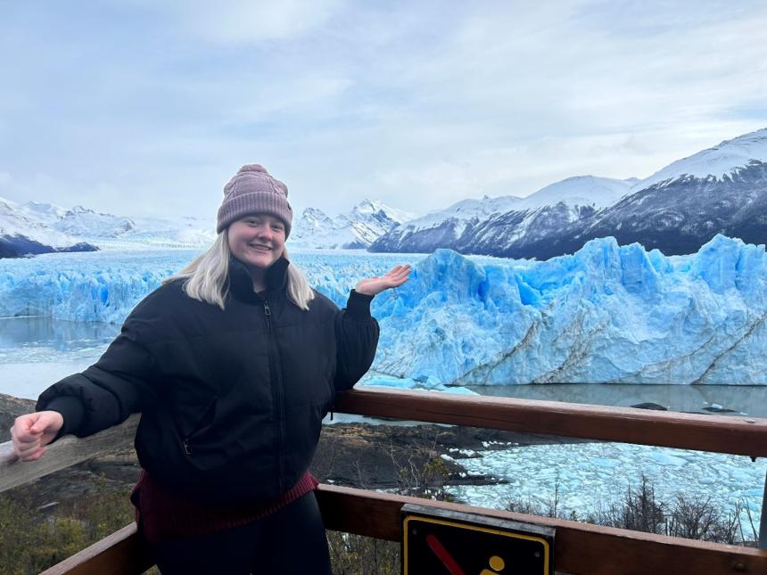 Girl standing in front of glaciers